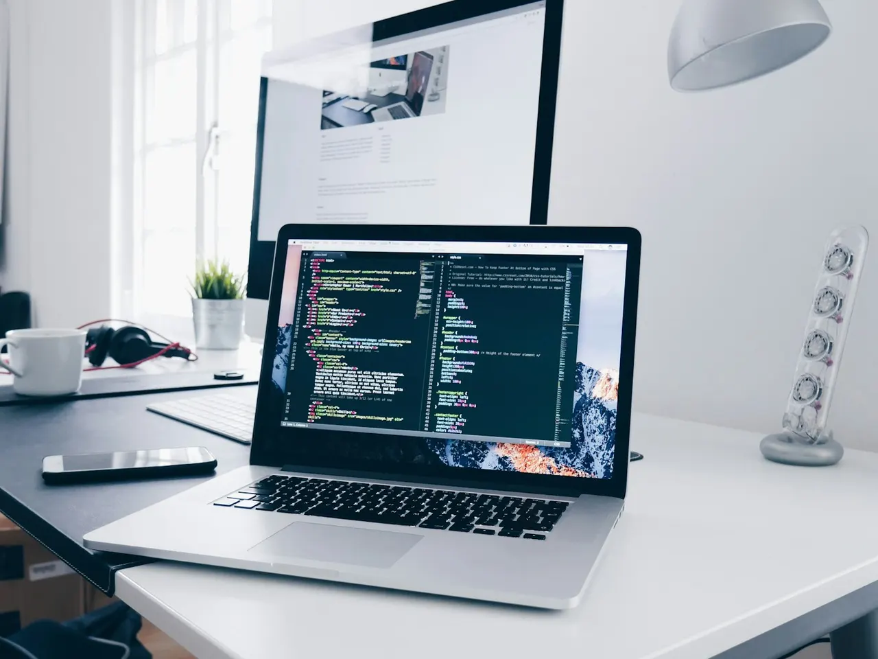 Laptop on a software development workspace